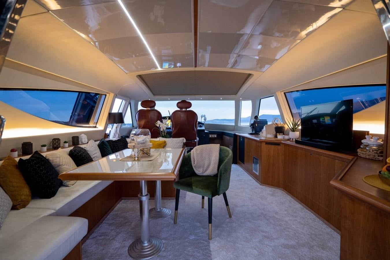 a room with a table and chairs aboard F68 Yacht for Sale