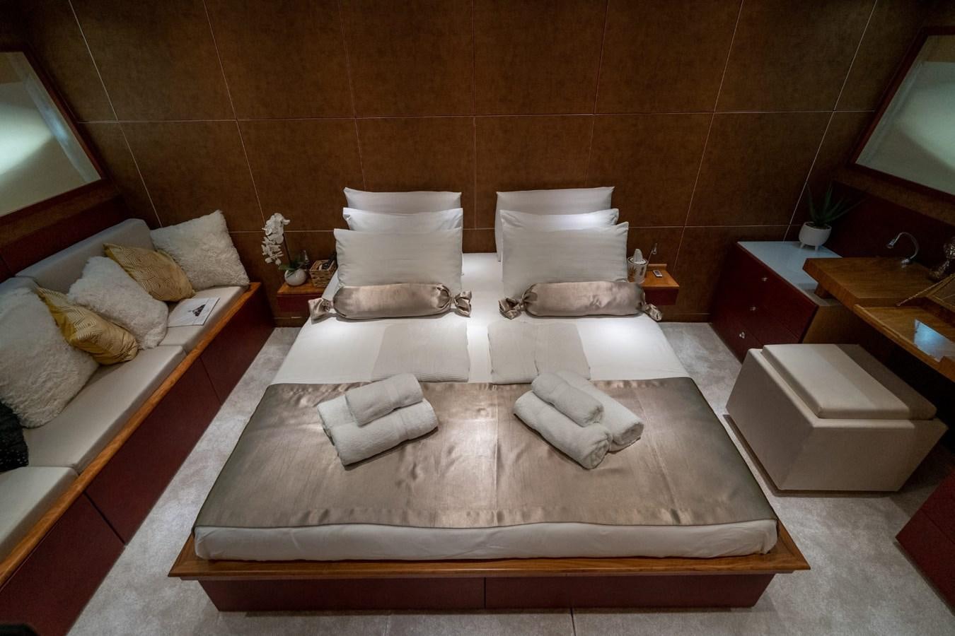 a room with a bed and a mirror aboard F68 Yacht for Sale