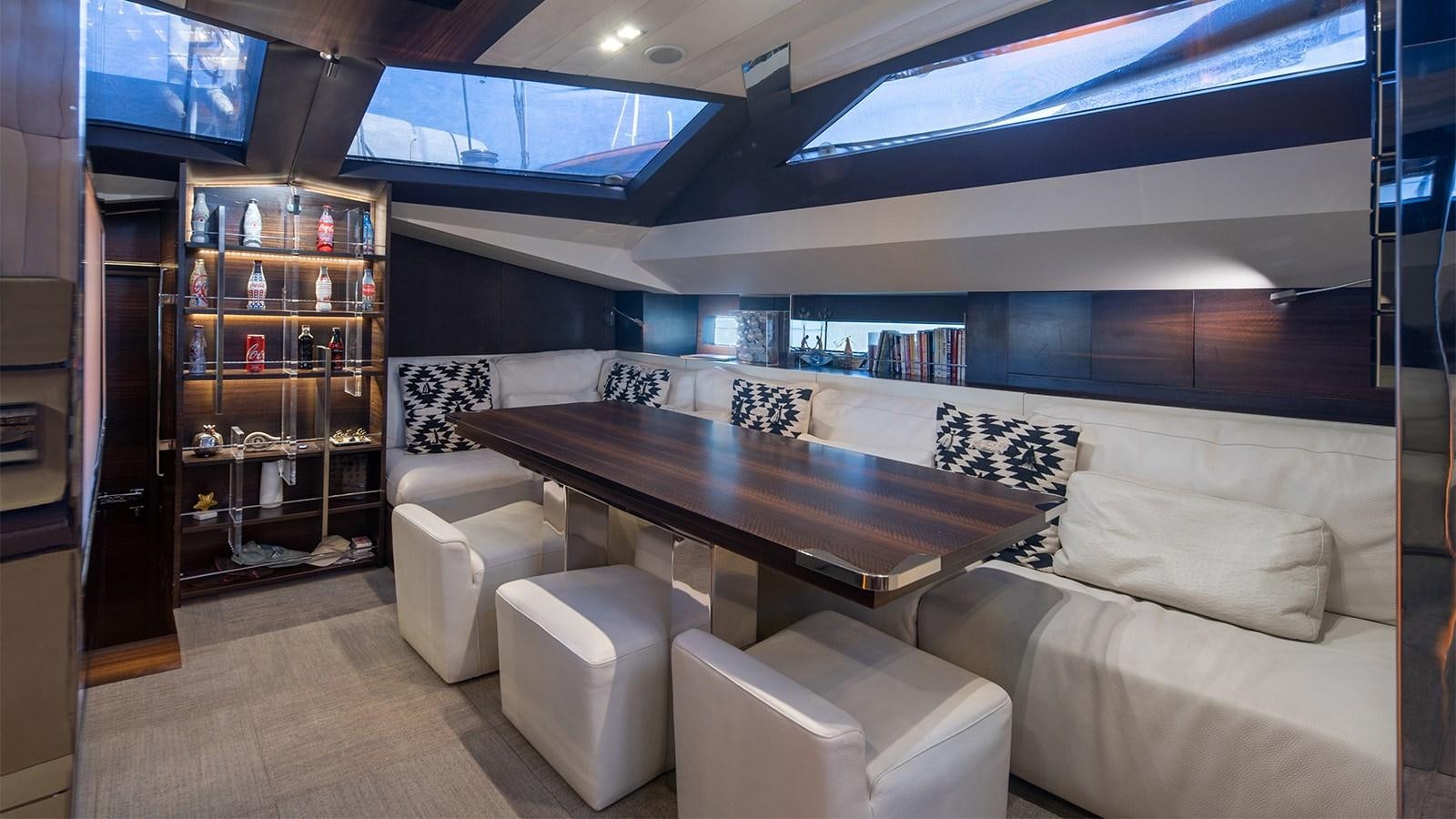 a room with a couch and a table aboard GIGRECA Yacht for Sale