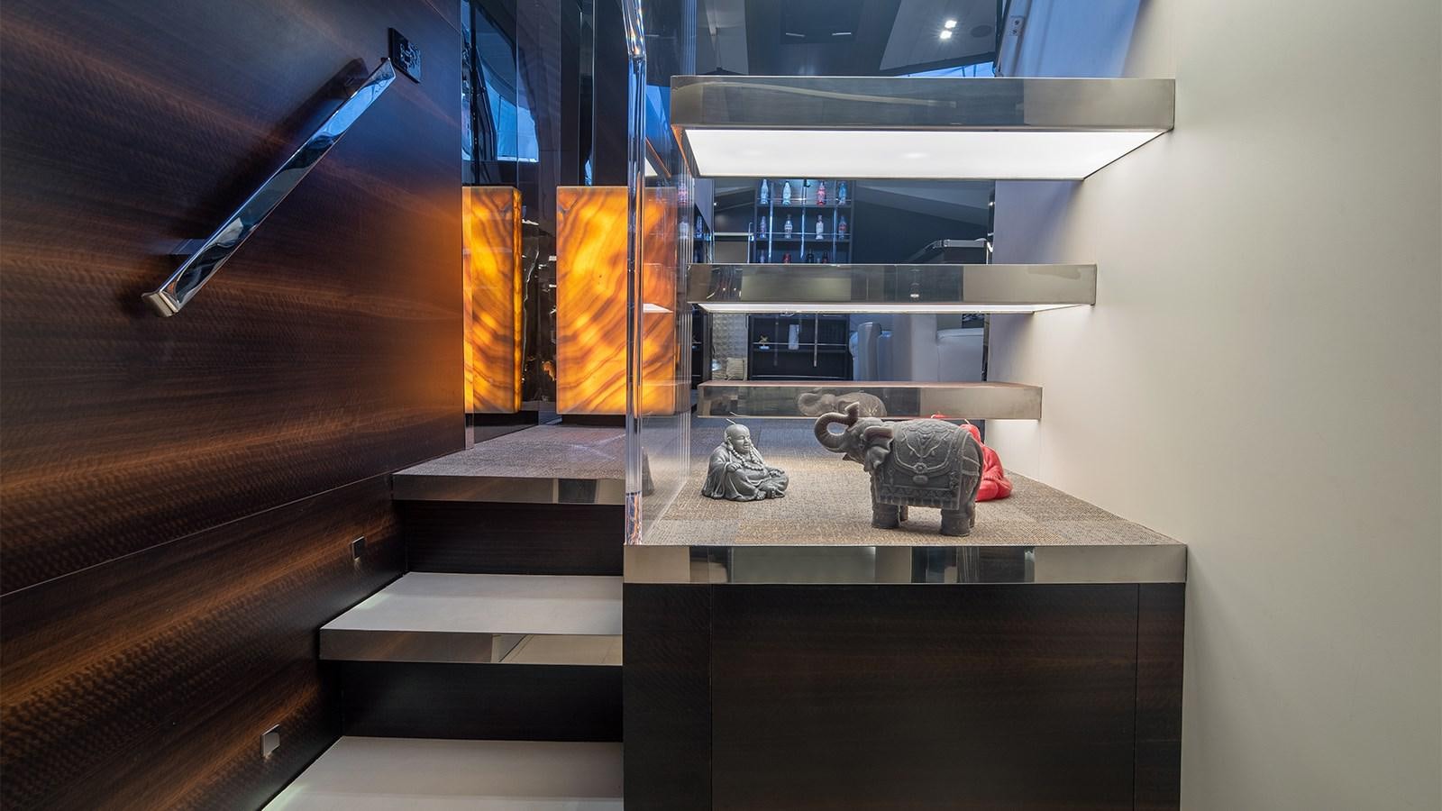 a room with a desk and a shelf with objects on it aboard GIGRECA Yacht for Sale