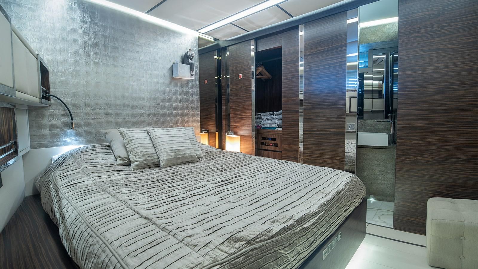 a bed in a room aboard GIGRECA Yacht for Sale