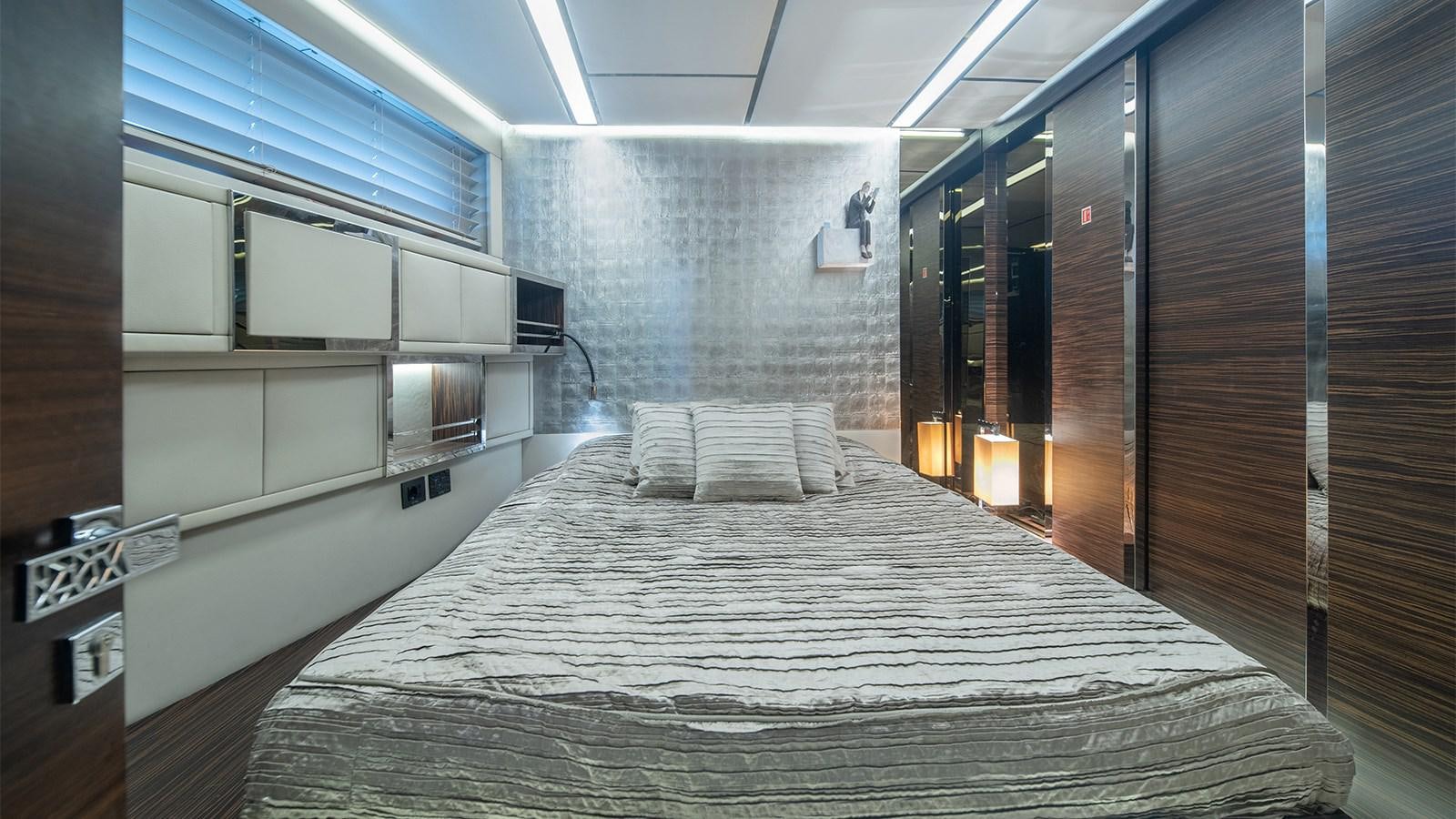 a bed in a room aboard GIGRECA Yacht for Sale