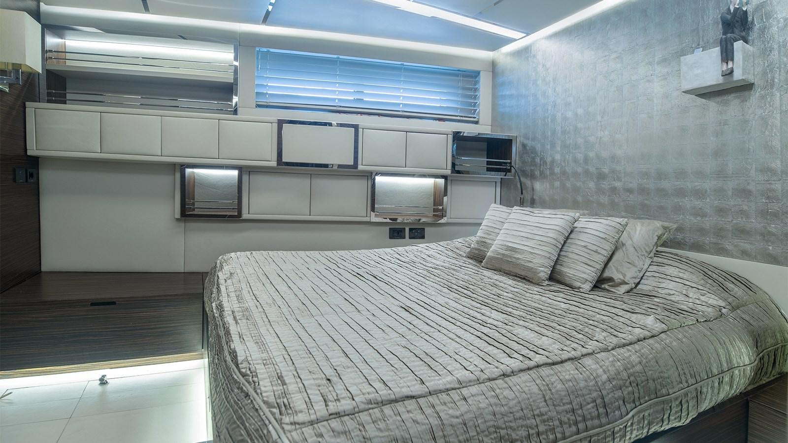 a room with a bed and a tv aboard GIGRECA Yacht for Sale