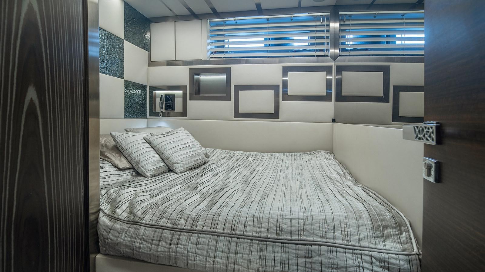 a bed with white sheets aboard GIGRECA Yacht for Sale