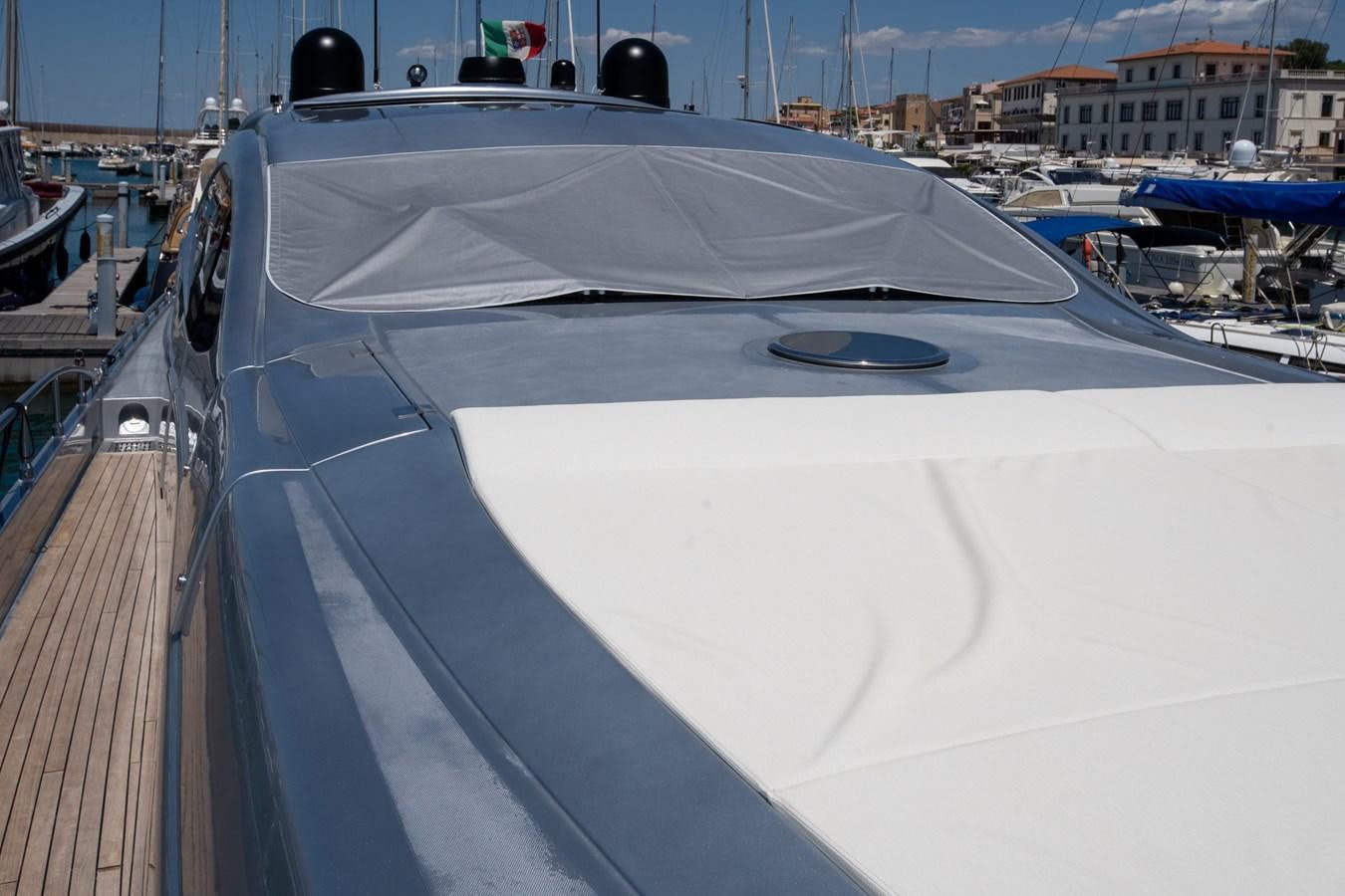 a white yacht on a dock aboard APHRODITE Yacht for Sale