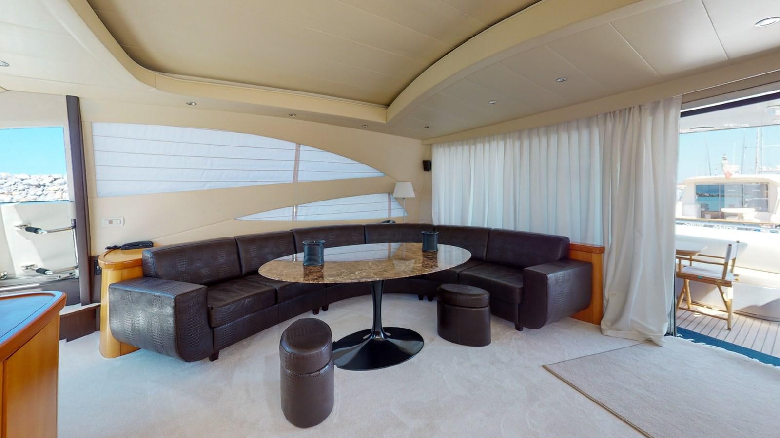 a living room with a couch and a table aboard APHRODITE Yacht for Sale