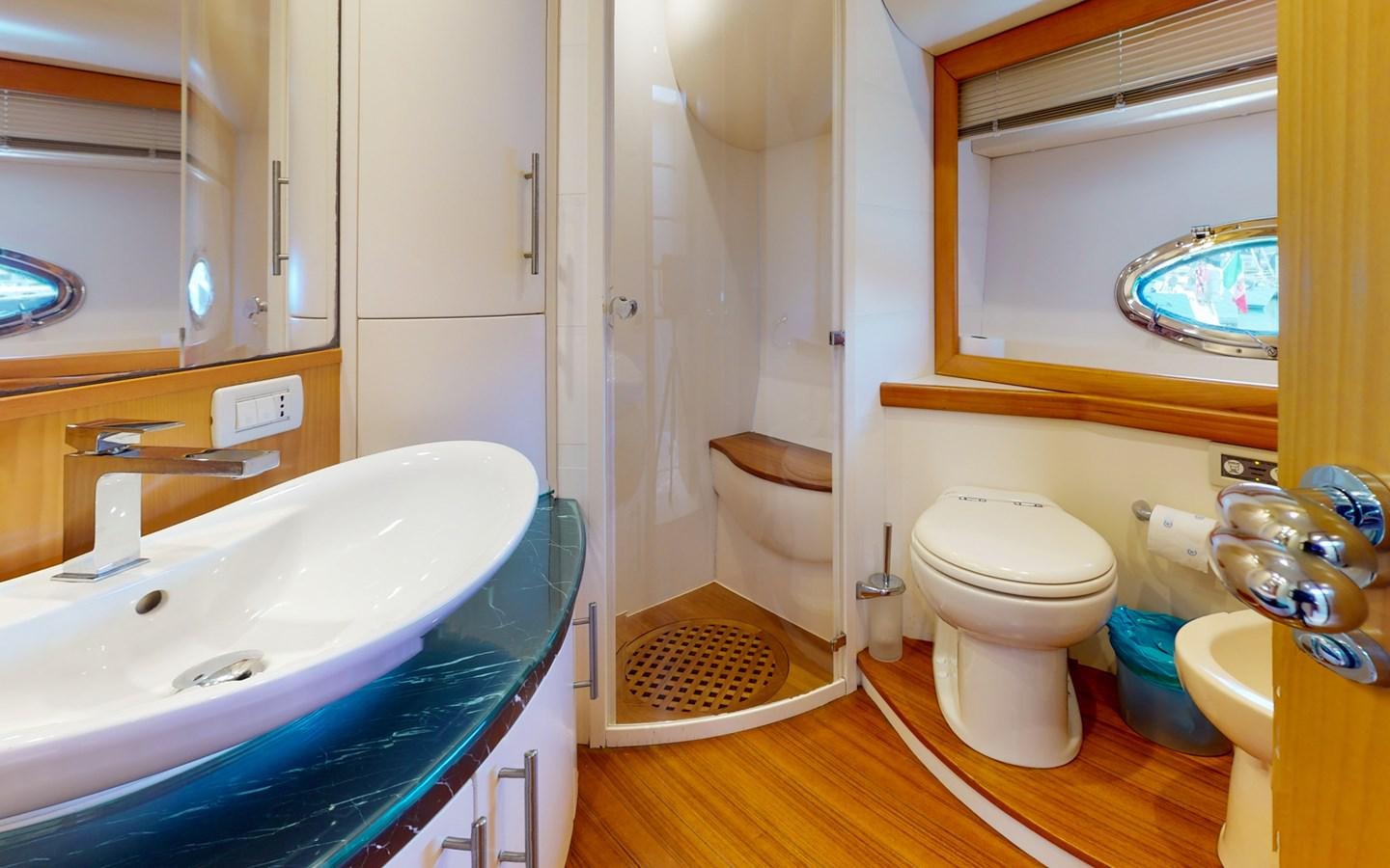 a bathroom with a sink toilet and a bathtub aboard APHRODITE Yacht for Sale