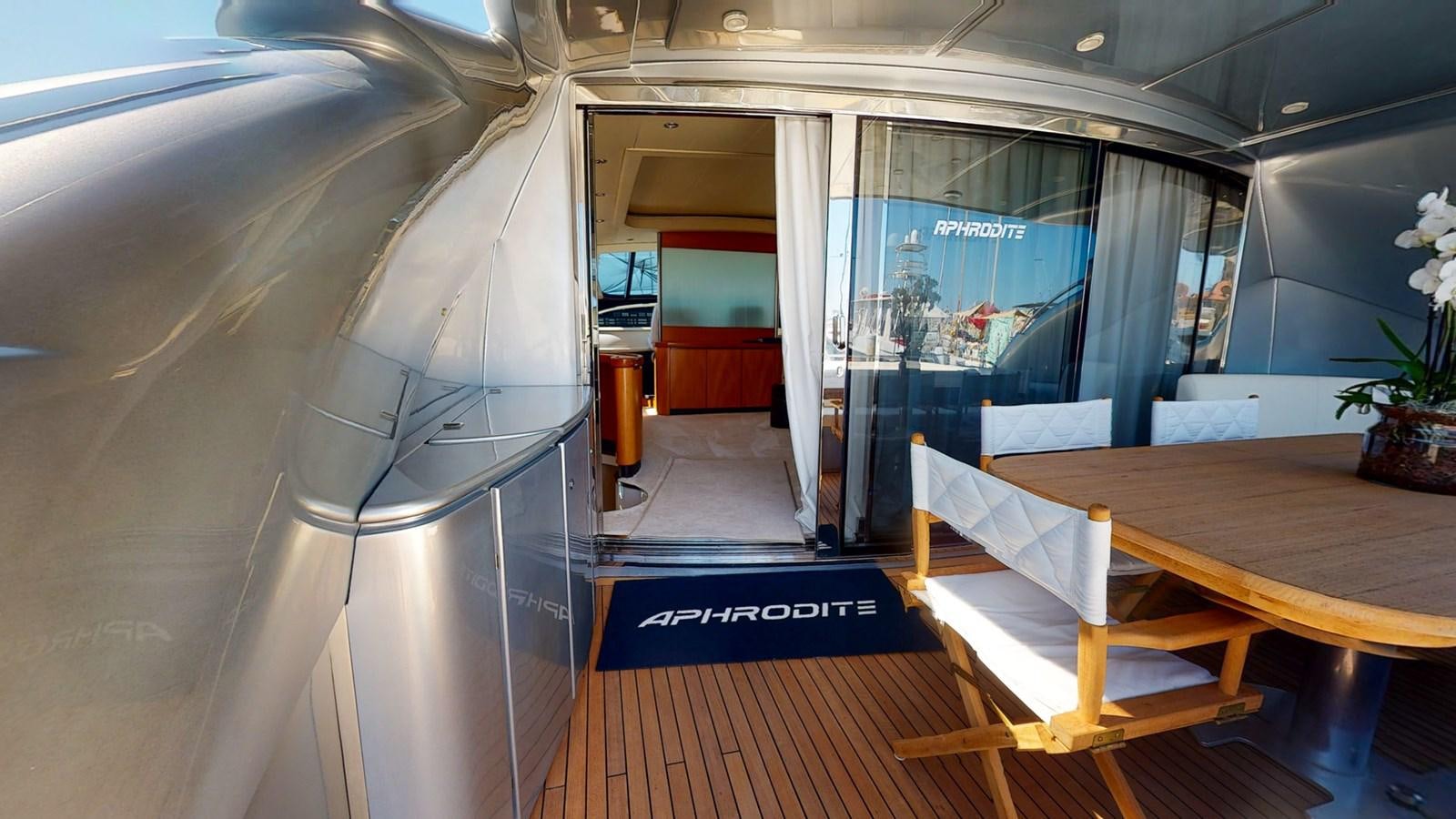 a room with a table and chairs aboard APHRODITE Yacht for Sale