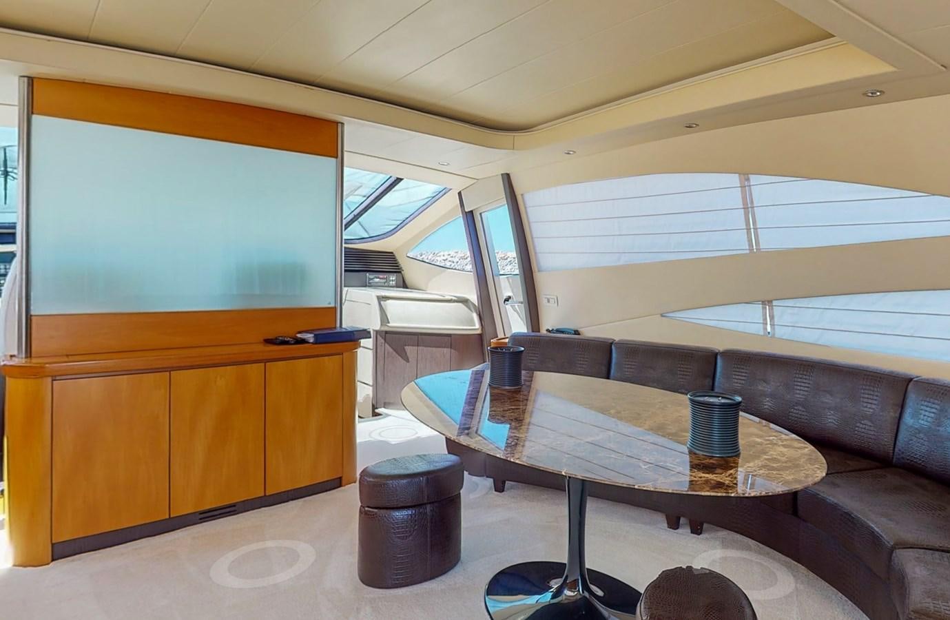 a room with a couch and a table aboard APHRODITE Yacht for Sale