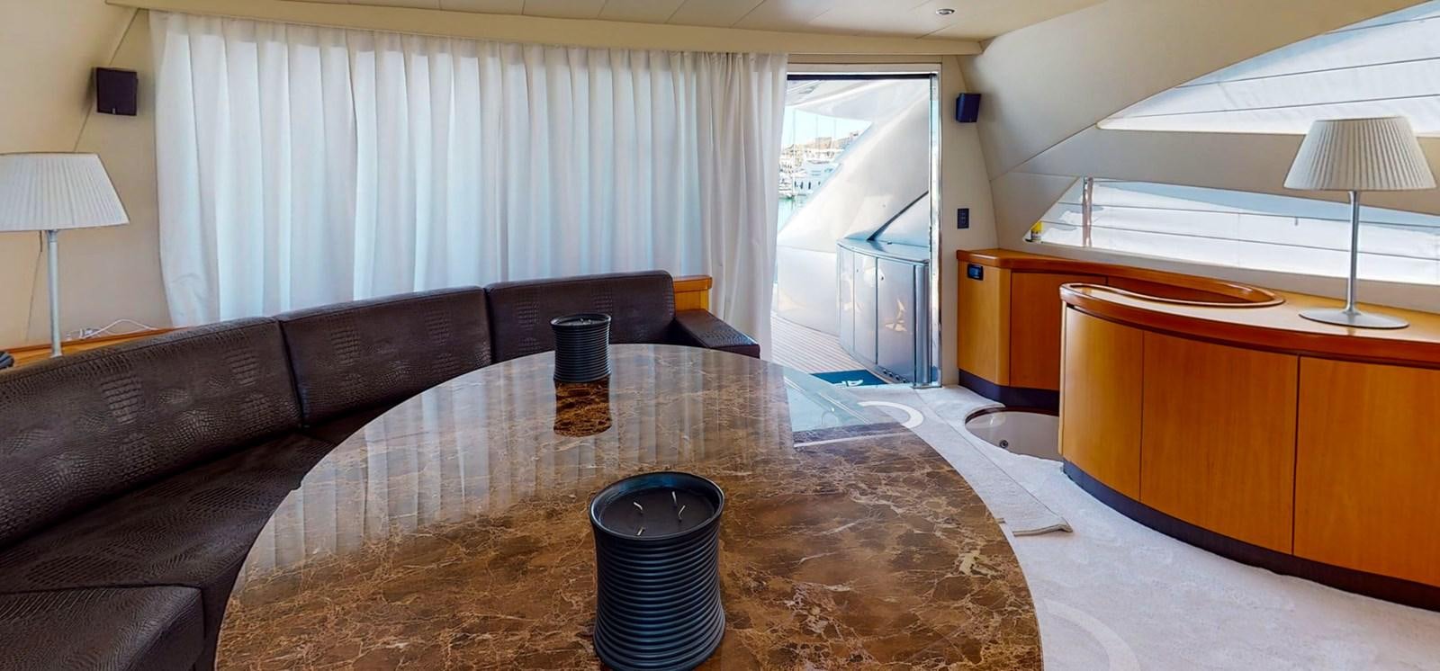 a living room with a couch and a table aboard APHRODITE Yacht for Sale