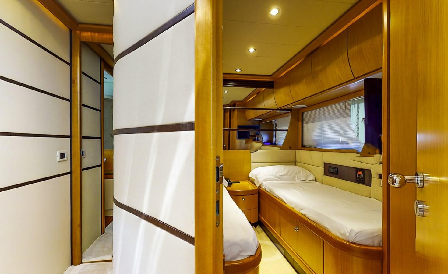 a bedroom with a bed and a closet aboard APHRODITE Yacht for Sale