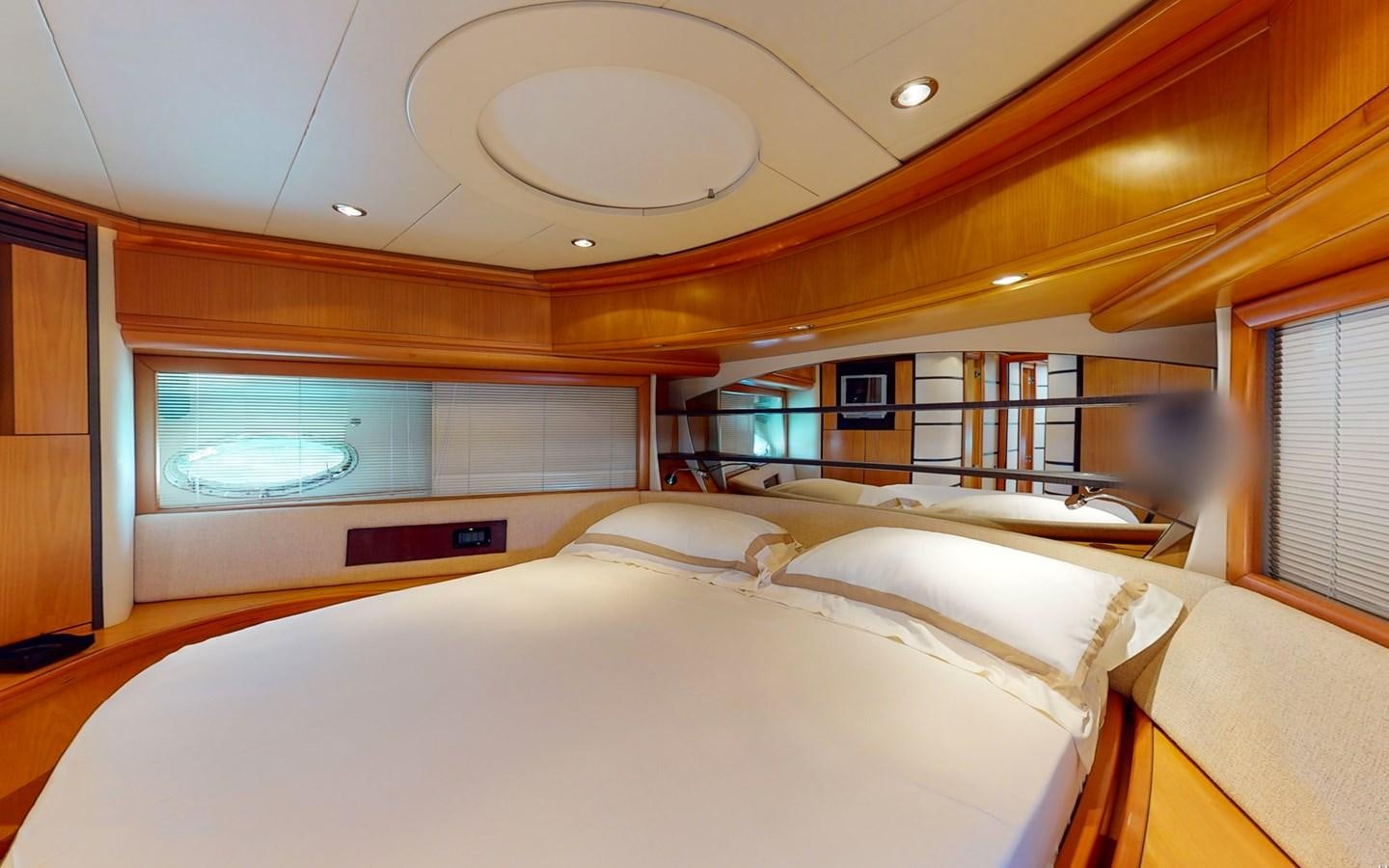 a room with a bed and a window aboard APHRODITE Yacht for Sale