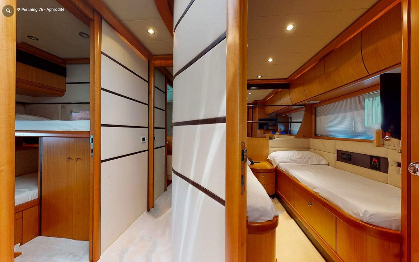a room with a bed and a closet aboard APHRODITE Yacht for Sale