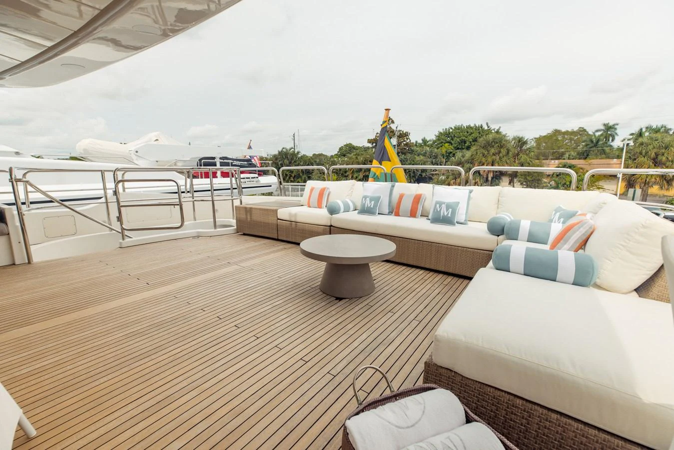 a deck with a couch and a pool aboard MAMMA MIA Yacht for Sale