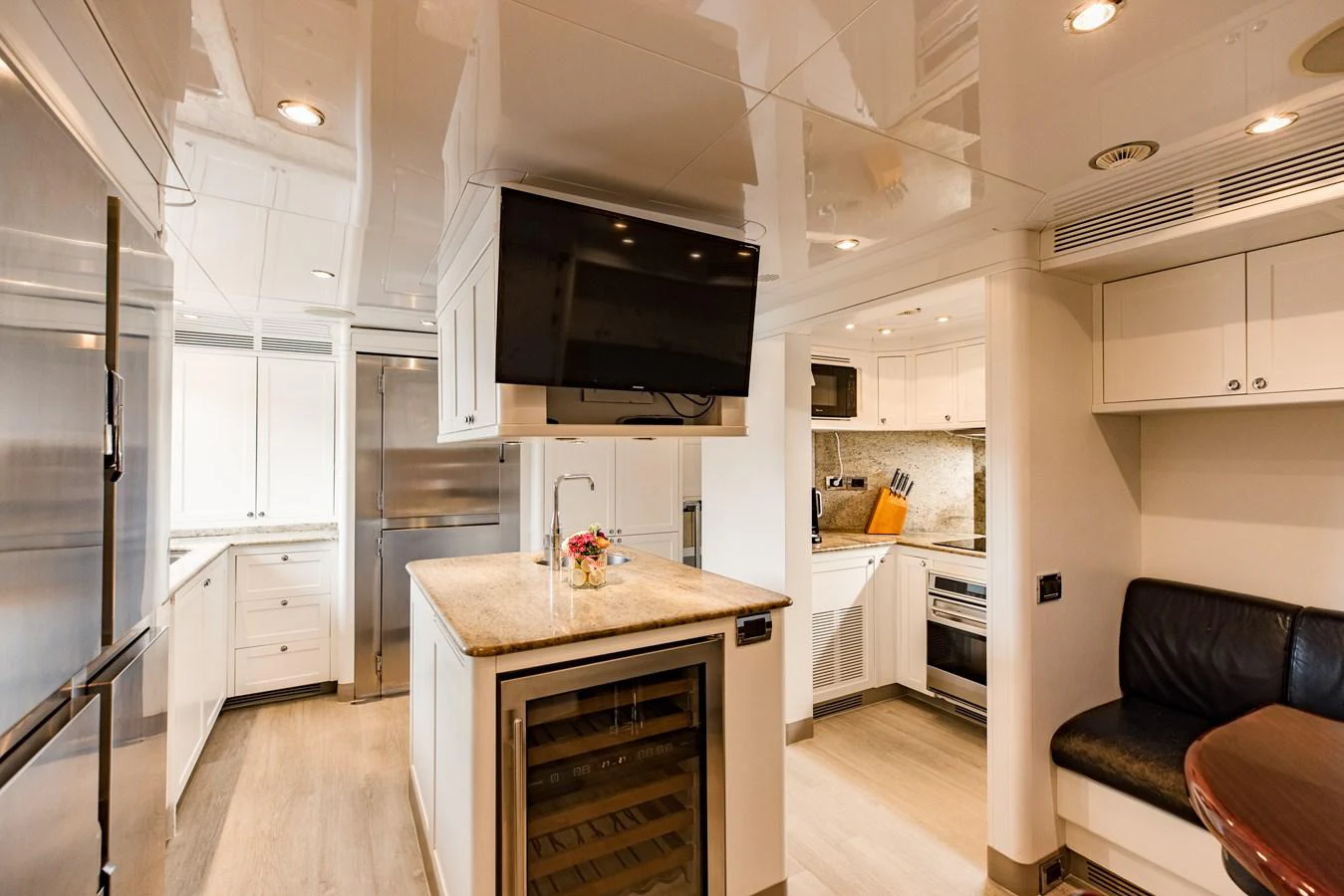 a kitchen with a large island aboard MAMMA MIA Yacht for Sale