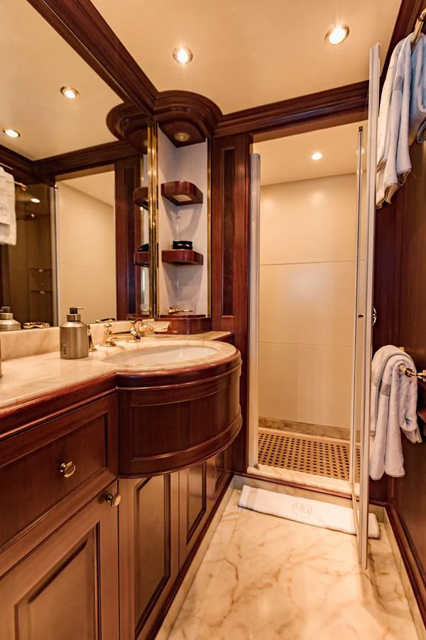 a bathroom with a sink and a mirror aboard MAMMA MIA Yacht for Sale