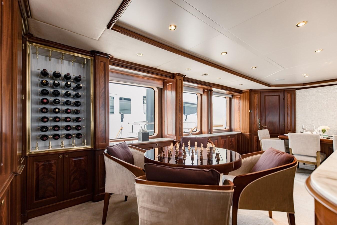 a living room with a wood cabinet aboard MAMMA MIA Yacht for Charter