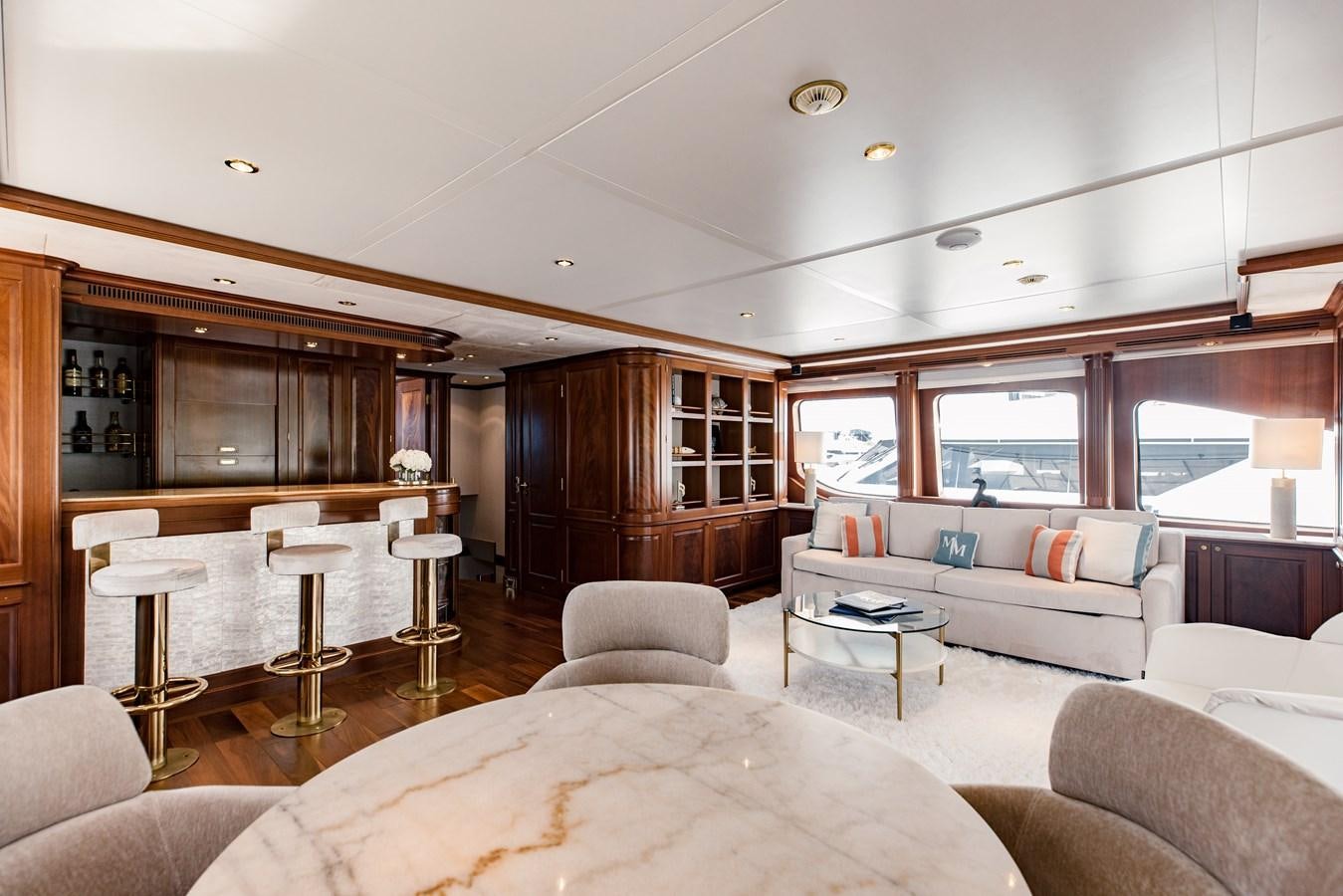 a living room with a large window aboard MAMMA MIA Yacht for Charter