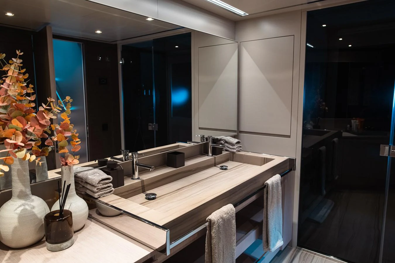a bathroom with a large mirror aboard O4 Yacht for Sale