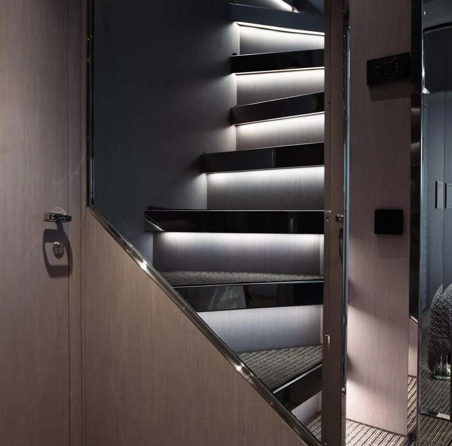 a set of metal stairs aboard O4 Yacht for Sale