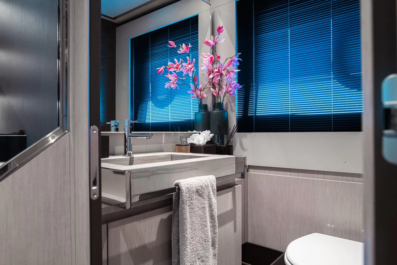a bathroom with a sink and a window aboard O4 Yacht for Sale
