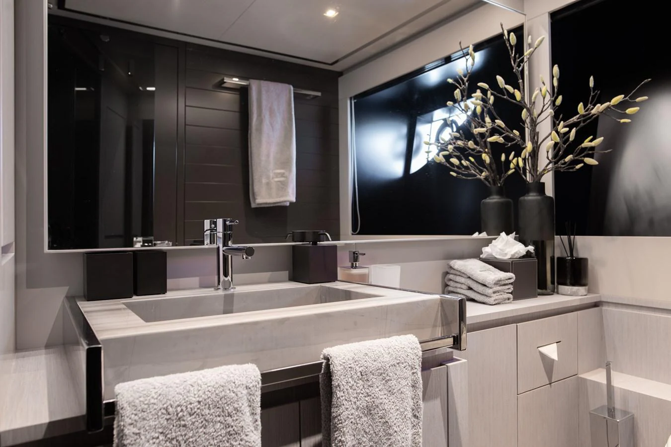 a bathroom with a large mirror aboard O4 Yacht for Sale