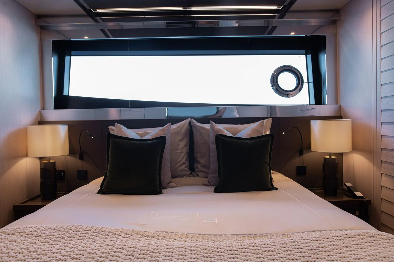 a bed with pillows aboard O4 Yacht for Sale