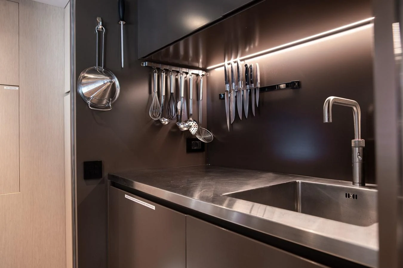 a kitchen with stainless steel sinks aboard O4 Yacht for Sale