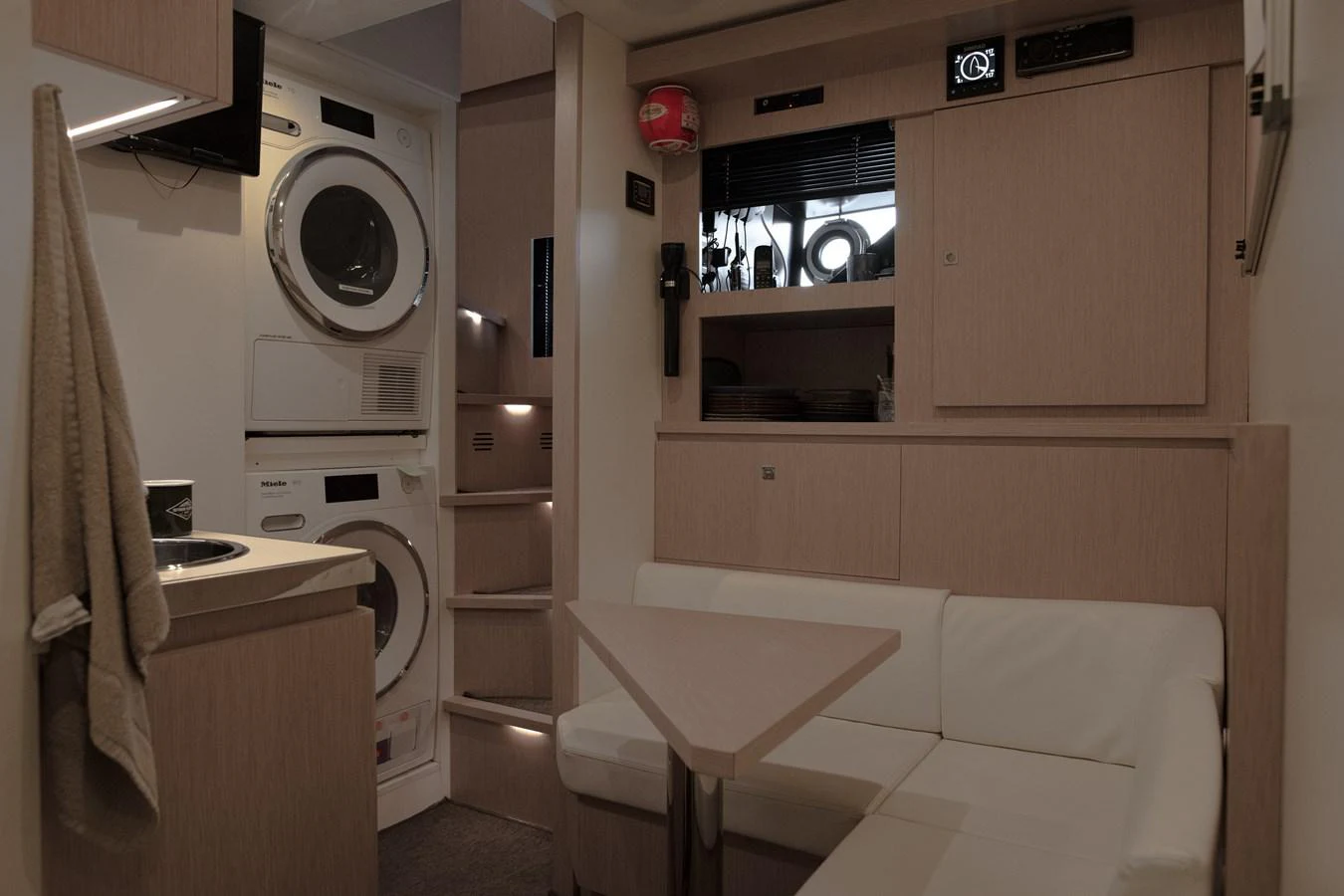 a small white room with a bed and a sink aboard O4 Yacht for Sale