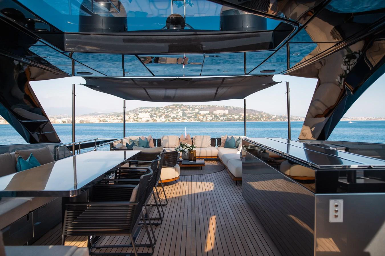 a deck with a view of the ocean and the deck aboard O4 Yacht for Sale