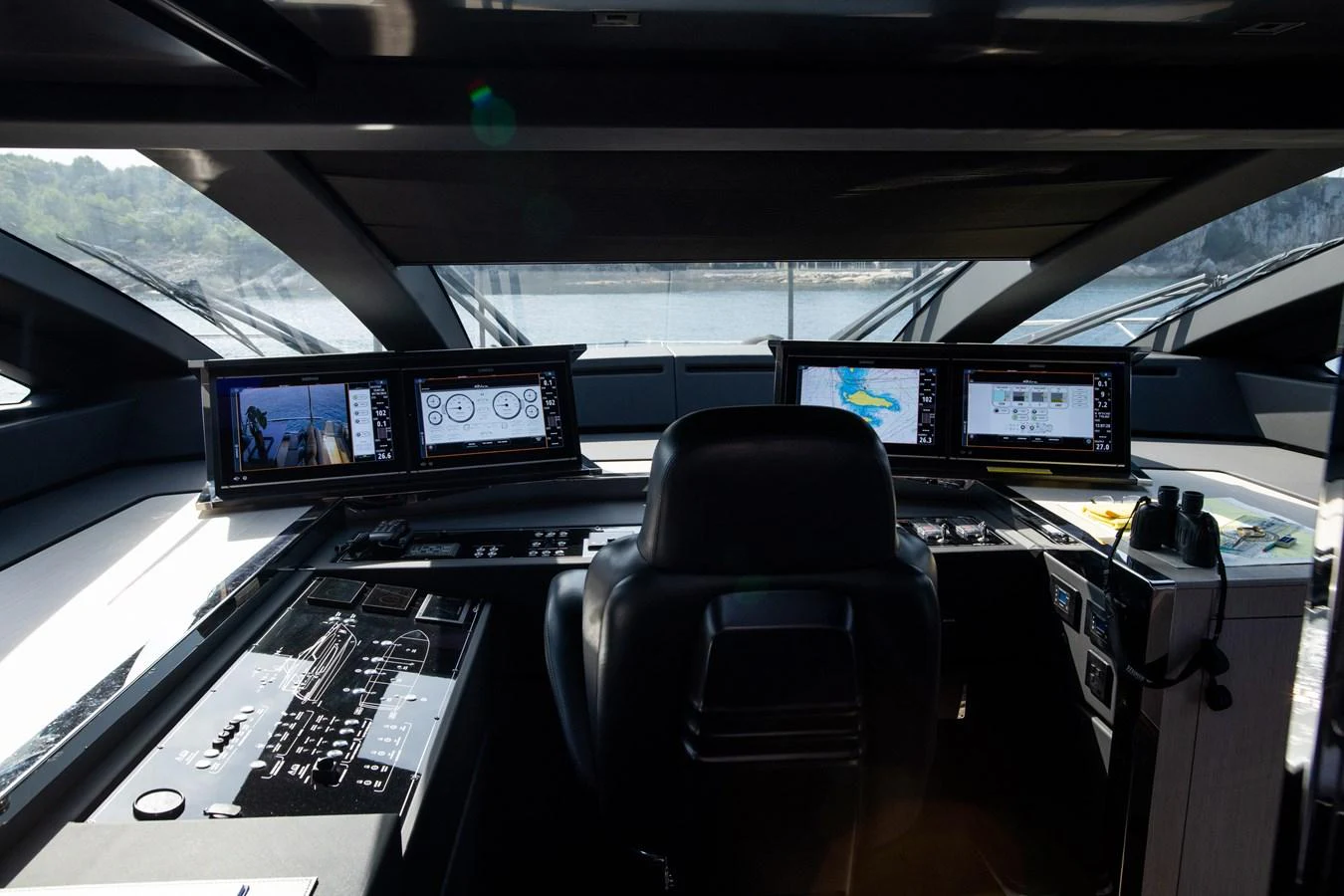 inside of a vehicle with monitors and screens aboard O4 Yacht for Sale