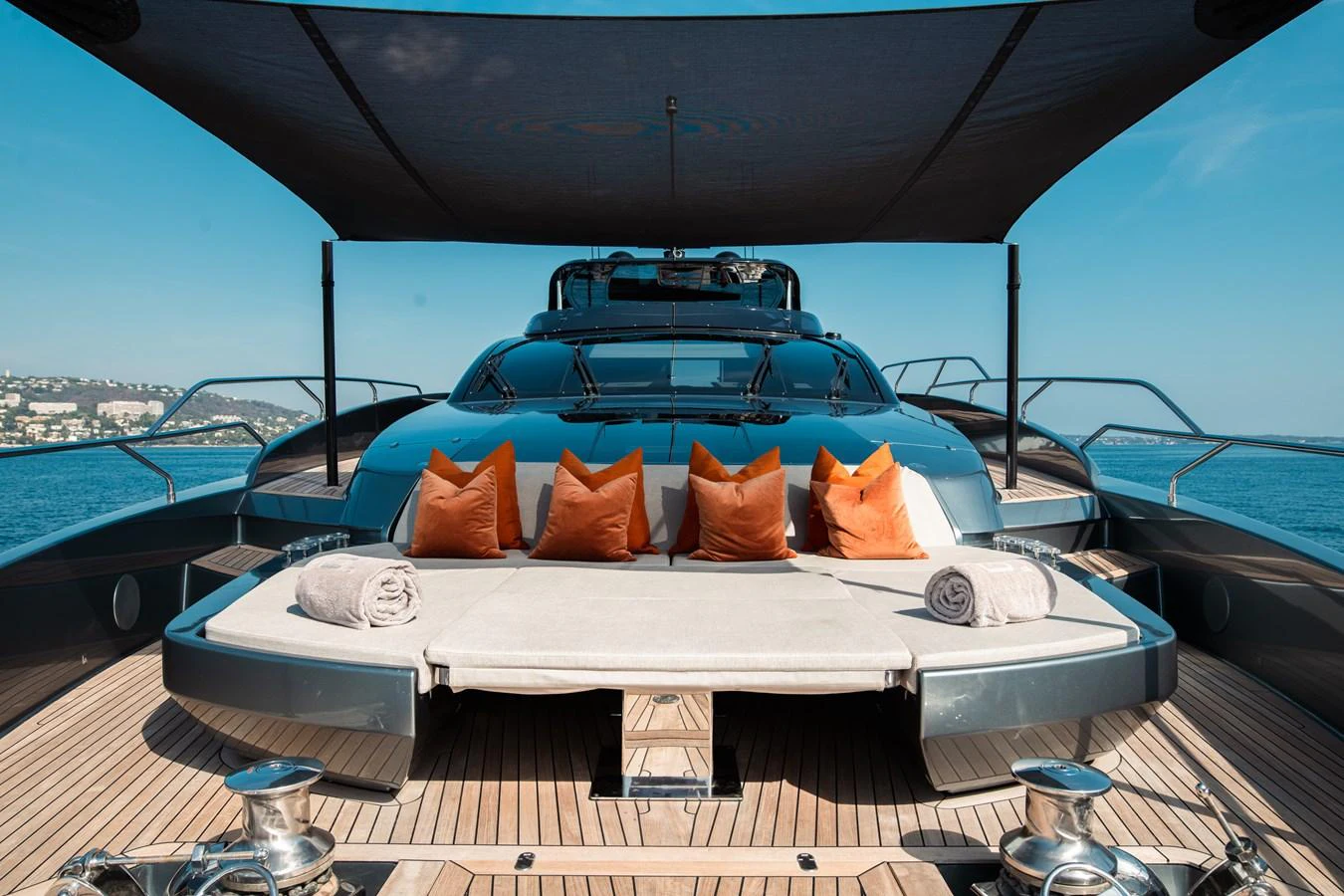 a white bed on a boat aboard O4 Yacht for Sale