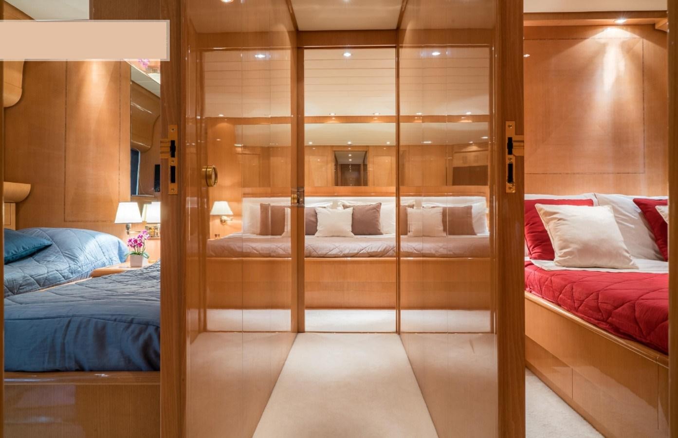 a room with a bed and a mirror aboard ROMACHRIS II Yacht for Sale
