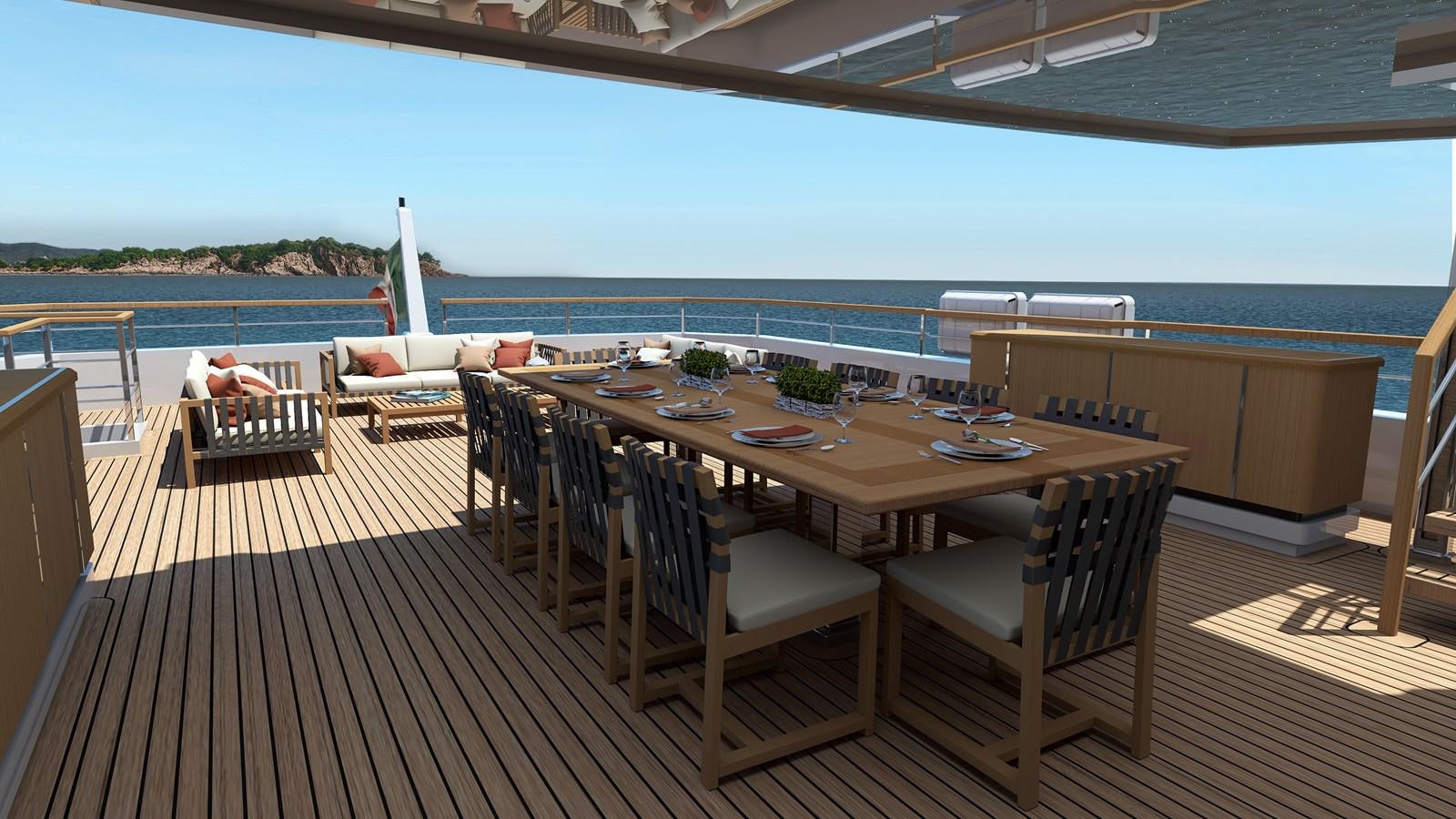 a deck with a table and chairs aboard BOW SPRIT Yacht for Sale