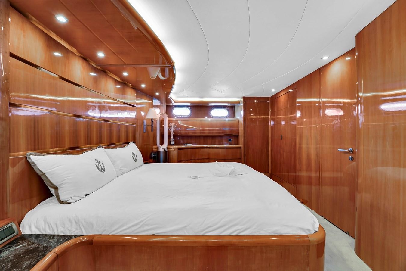 a bed with white sheets aboard STAMOS BIEN Yacht for Sale
