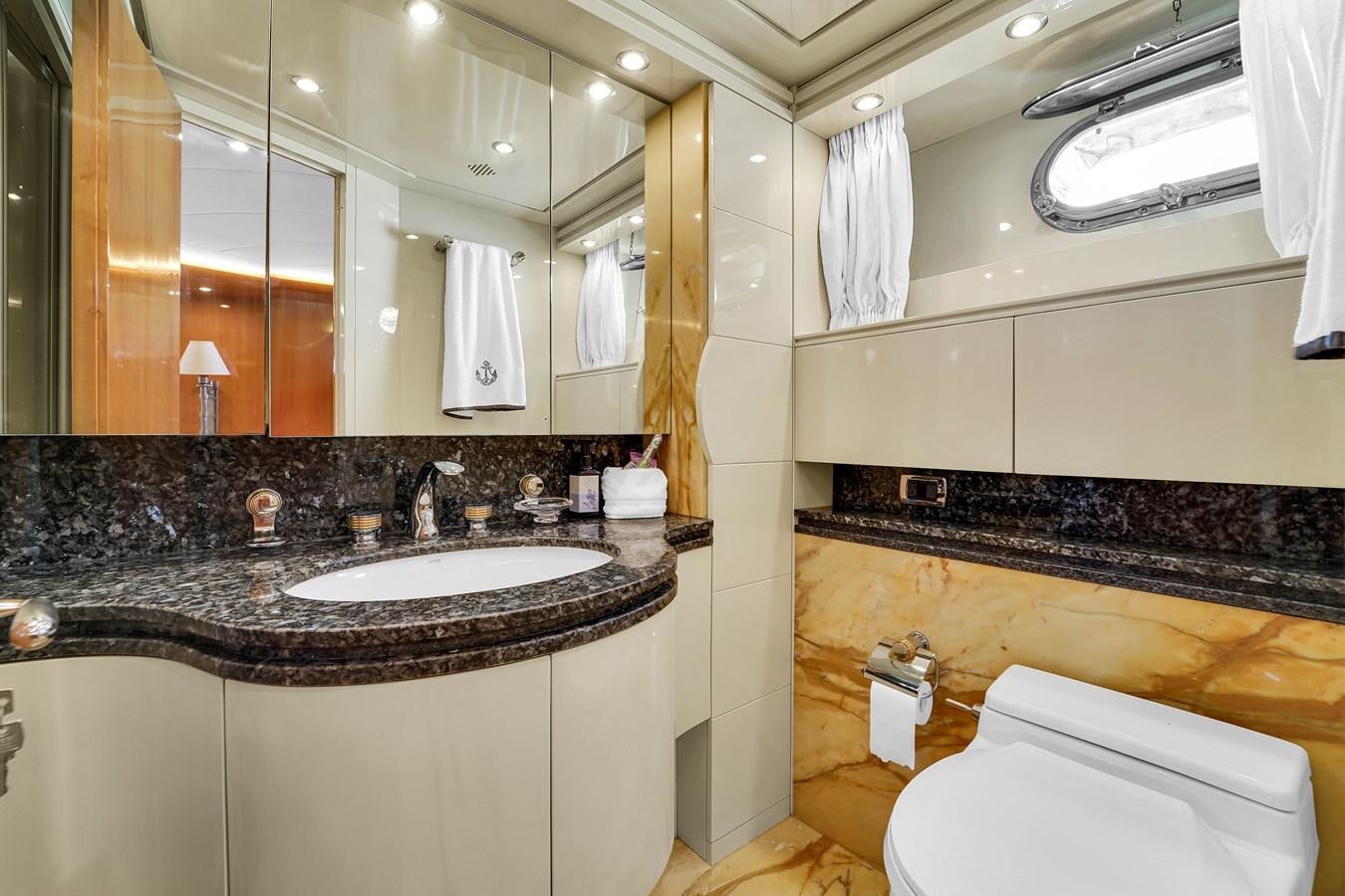 a bathroom with a large mirror aboard STAMOS BIEN Yacht for Sale
