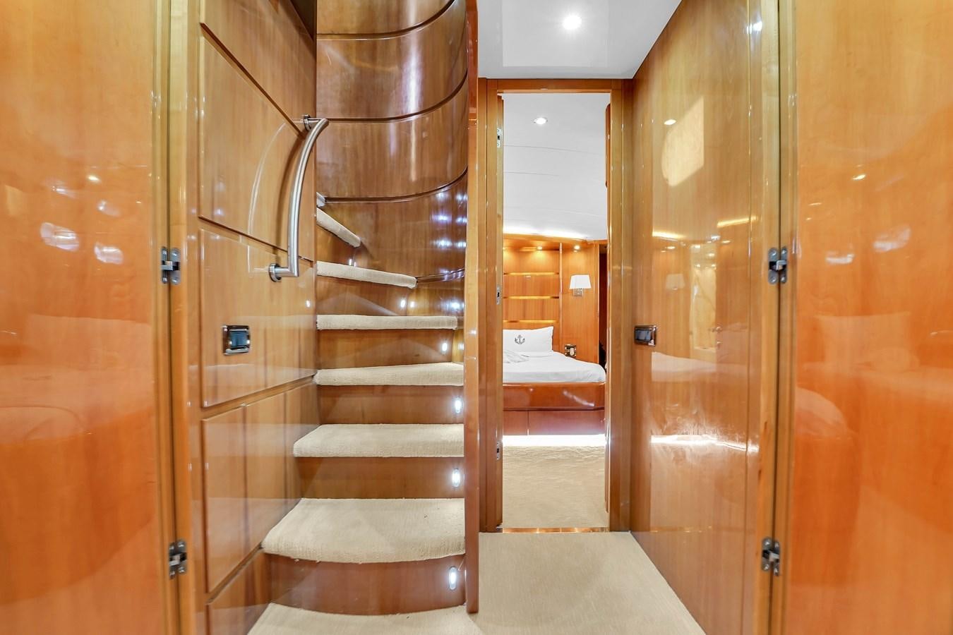 a wooden staircase in a room aboard STAMOS BIEN Yacht for Sale