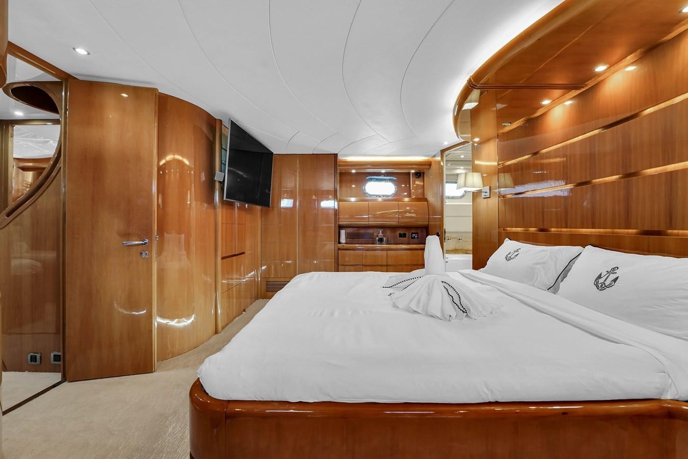 a bed with white sheets aboard STAMOS BIEN Yacht for Sale