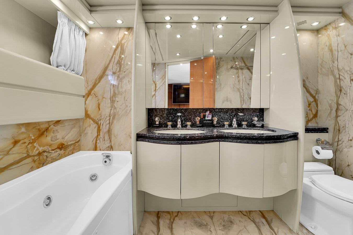 a bathroom with a bathtub sink and toilet aboard STAMOS BIEN Yacht for Sale