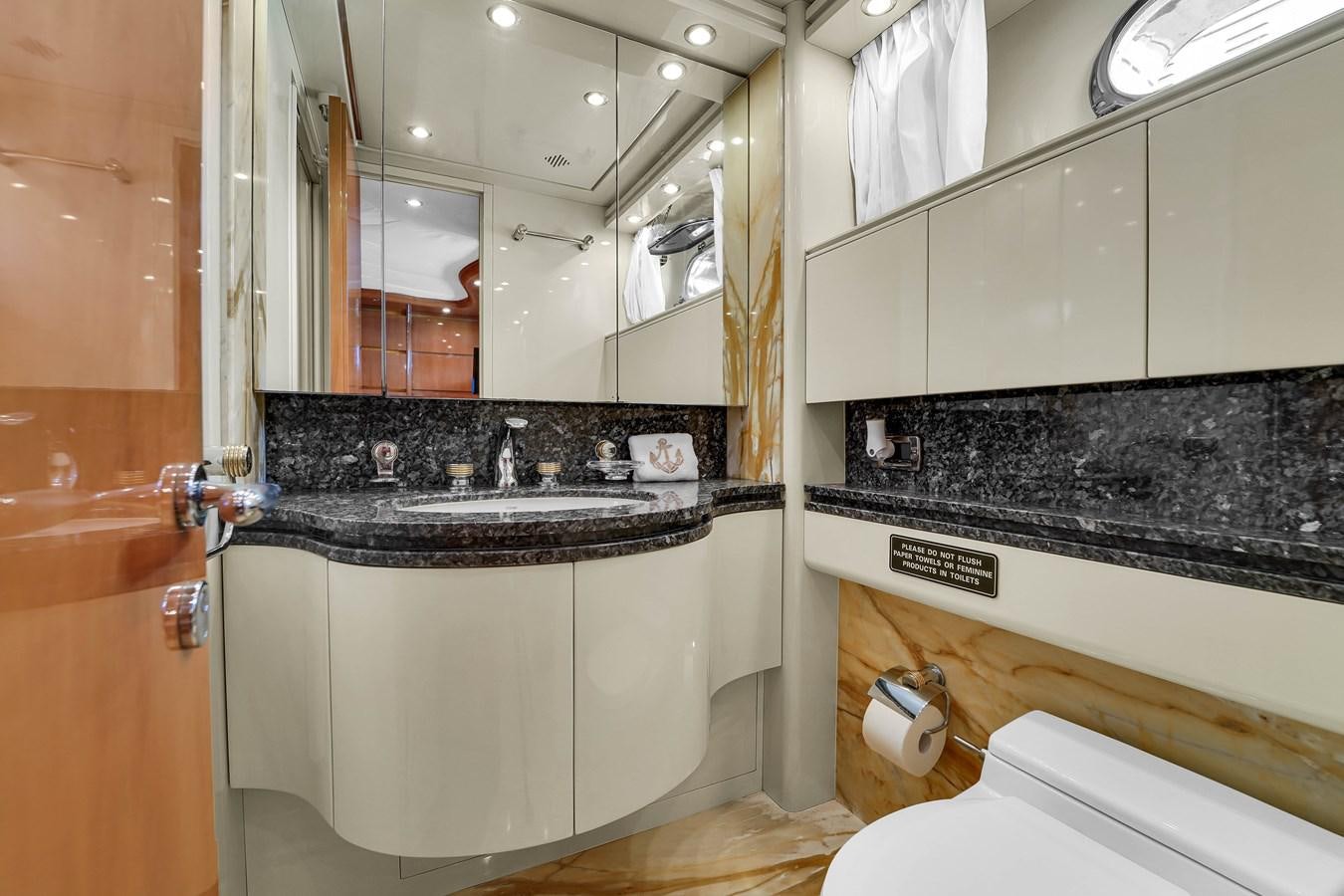a bathroom with a sink and a mirror aboard STAMOS BIEN Yacht for Sale