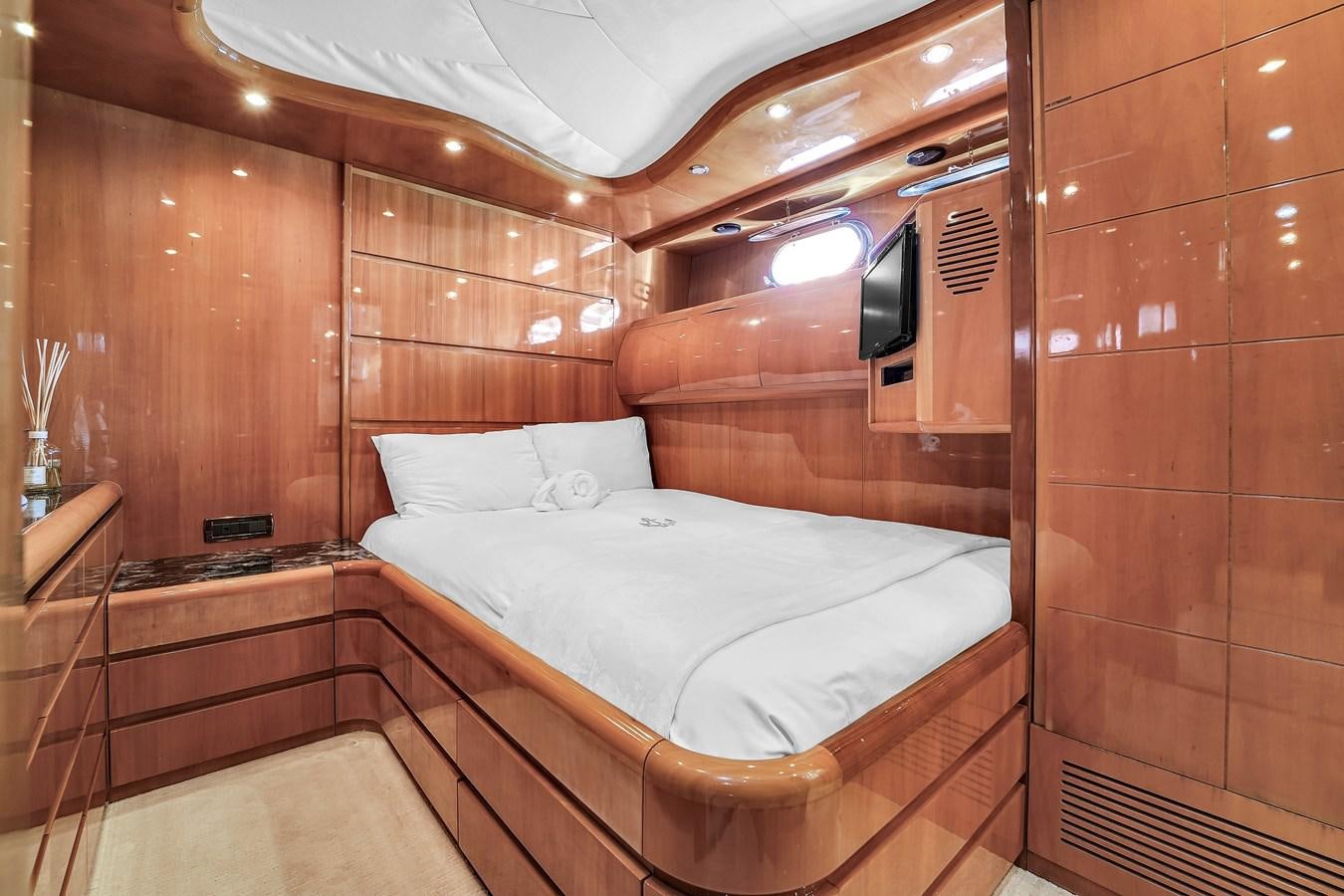 a room with a bed and a mirror aboard STAMOS BIEN Yacht for Sale