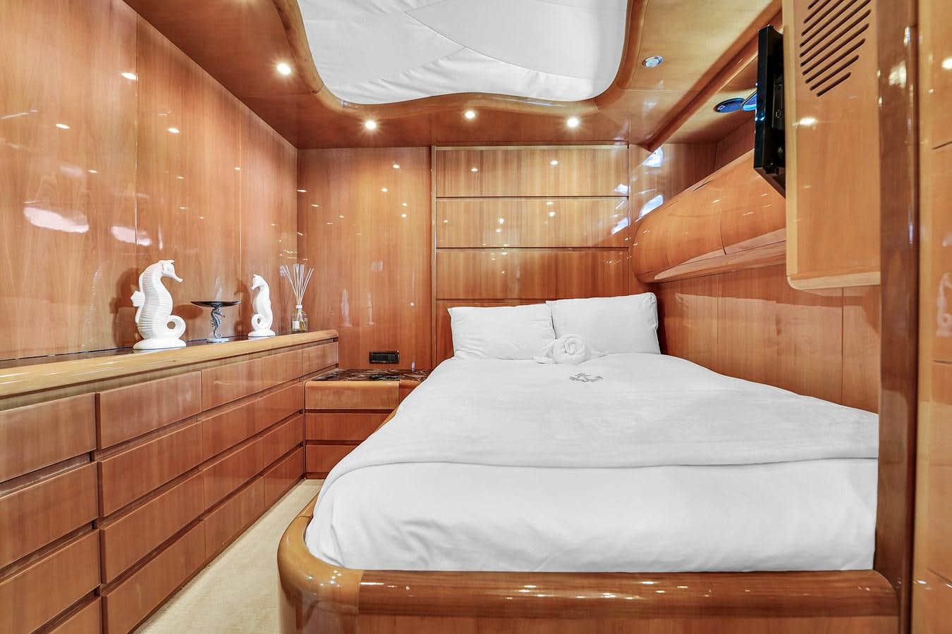 a bed with white sheets aboard STAMOS BIEN Yacht for Sale