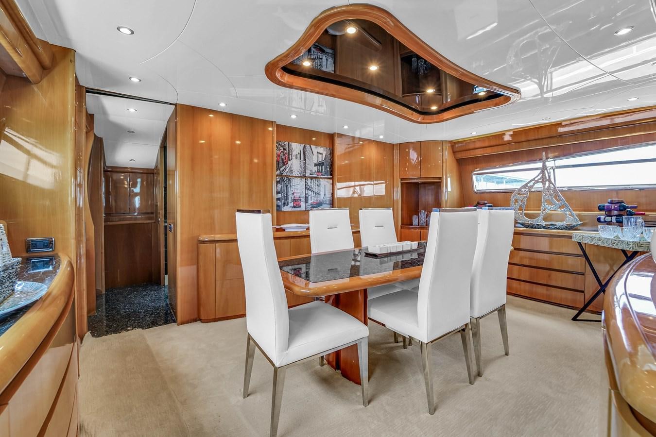 a room with a table and chairs aboard STAMOS BIEN Yacht for Sale