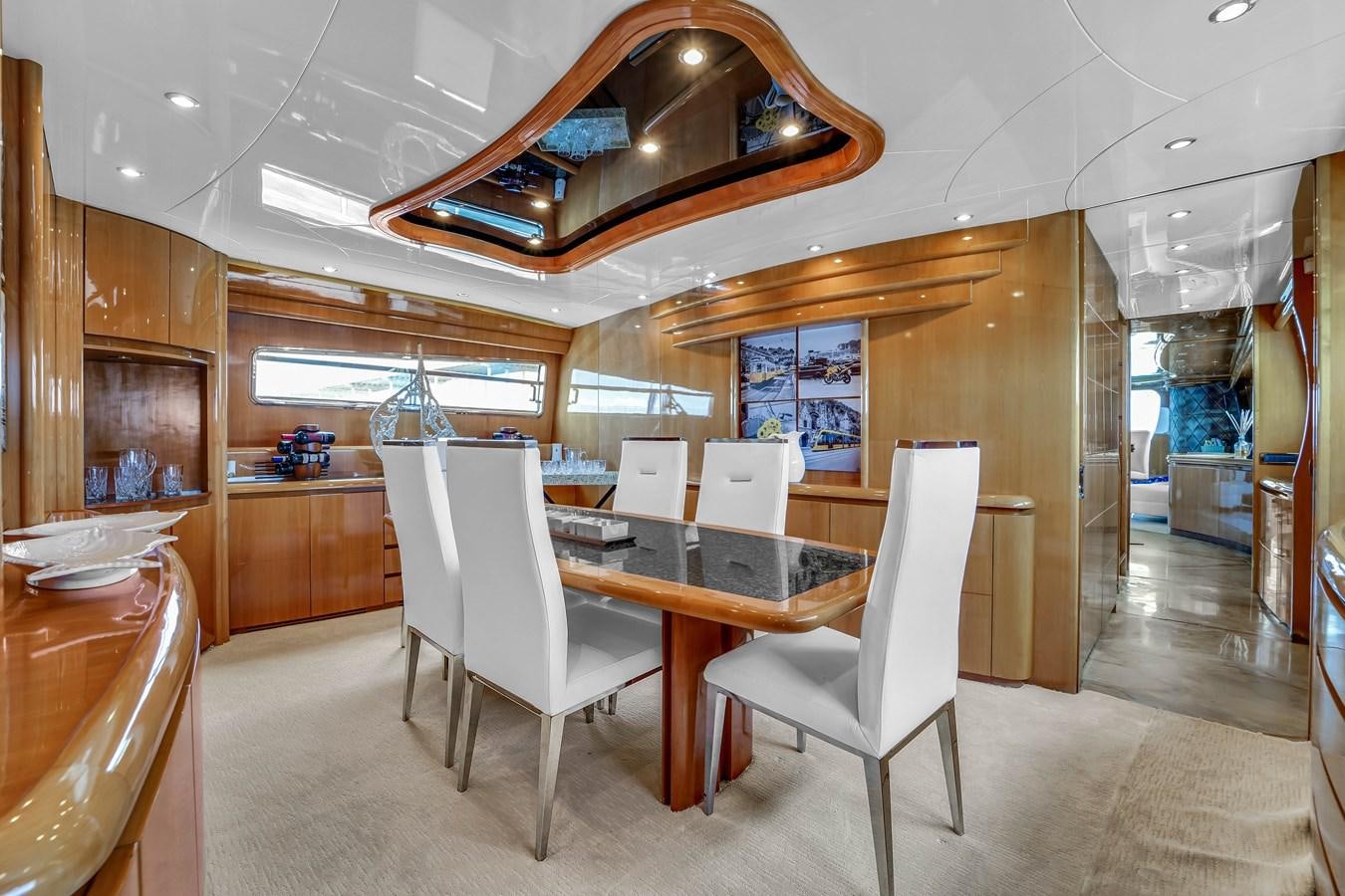 a kitchen with a table and chairs aboard STAMOS BIEN Yacht for Sale