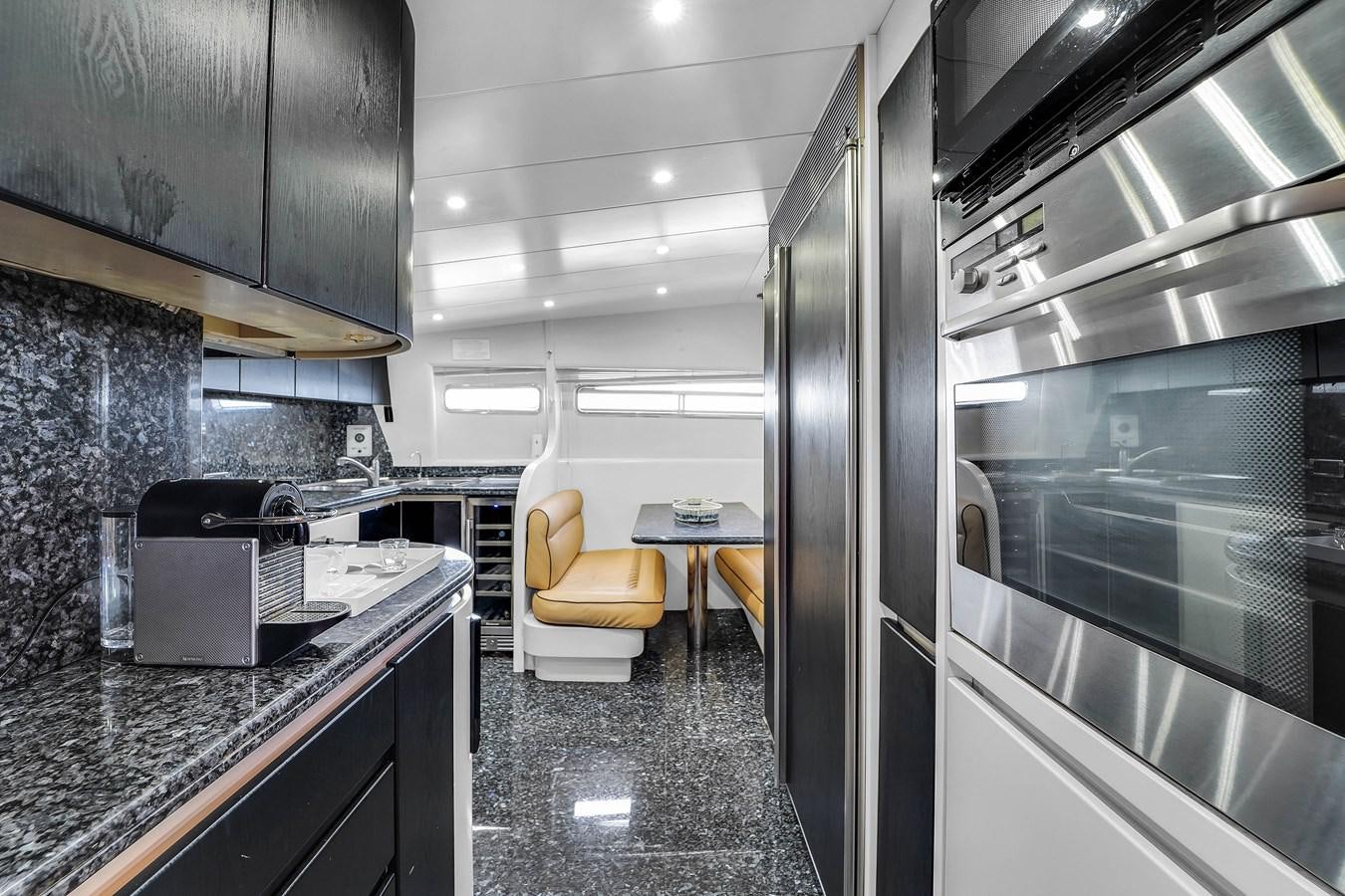 a kitchen with stainless steel appliances aboard STAMOS BIEN Yacht for Sale
