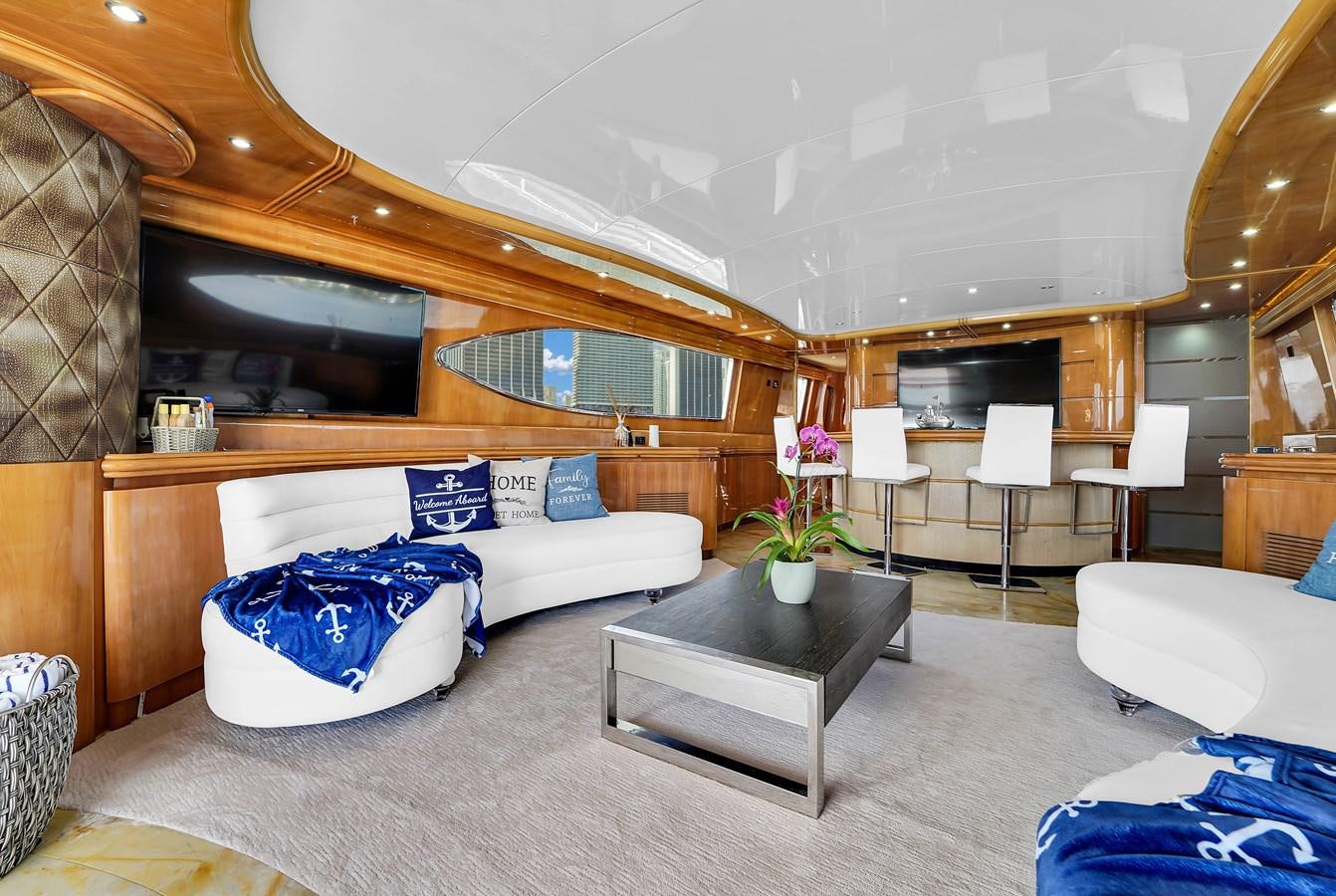 a living room with a couch and a table aboard STAMOS BIEN Yacht for Sale