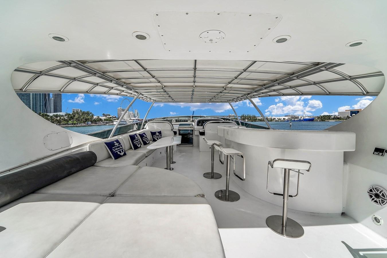 a white room with a table and chairs aboard STAMOS BIEN Yacht for Sale