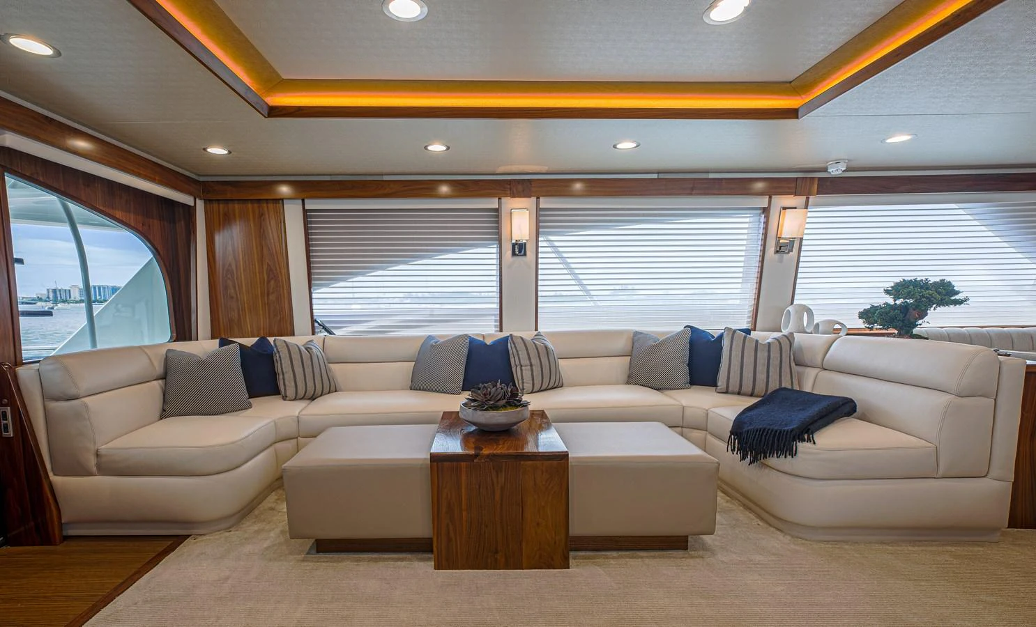 a living room with a couch and a coffee table aboard SPECULATOR Yacht for Sale