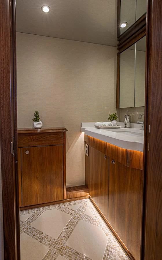 a bathroom with a sink and cabinets aboard SPECULATOR Yacht for Sale