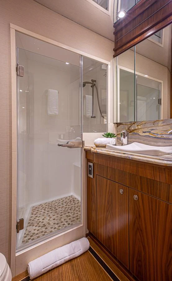 a bathroom with a shower and sink aboard SPECULATOR Yacht for Sale